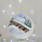 Новогодний шар на елку Santa Shop Різдвяна подорож Молочный 10 см 4820001179842